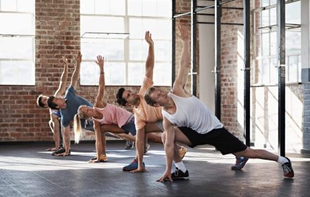 Shot of a group of people doing some strength training in a fitness class