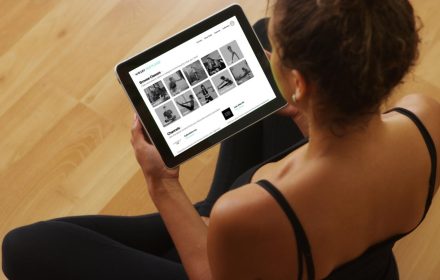 African American woman watching videos on tablet